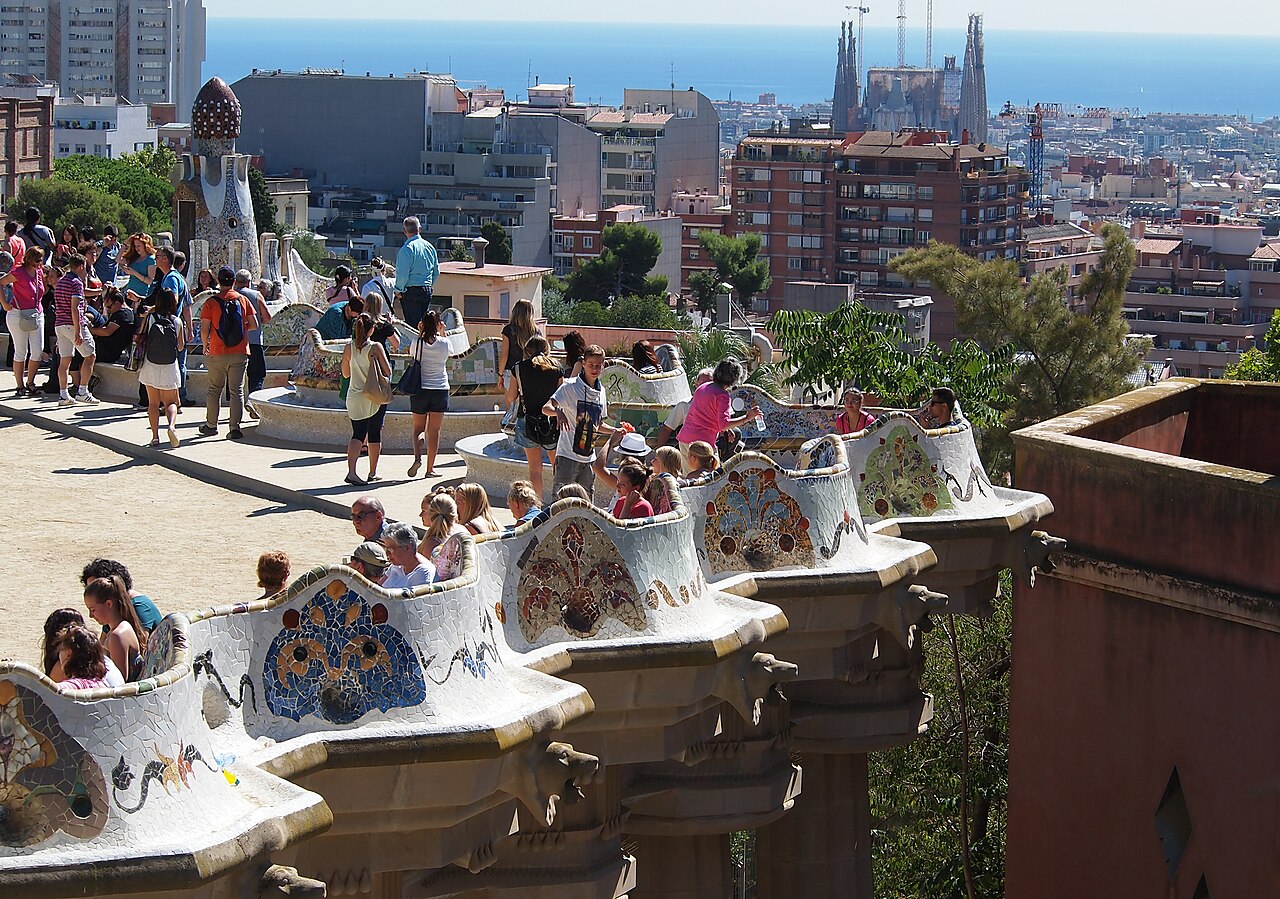 Park Guell terraces, the Sagrada Familia and Barcelona toward the Mediterranean Sea.